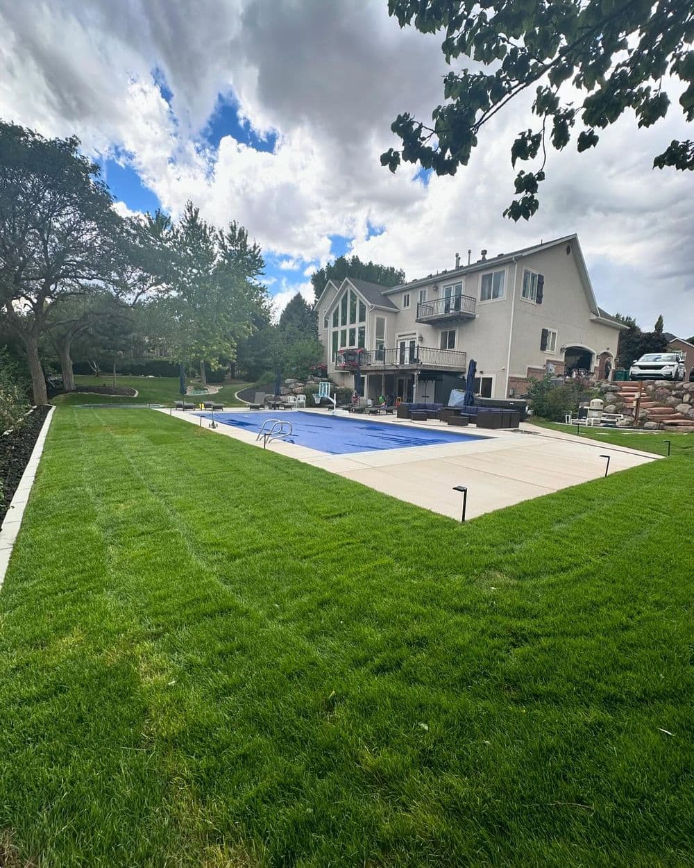 Project Post-Pool Landscape Install with Sod, Curbing, and Lava Rock in Lehi image
