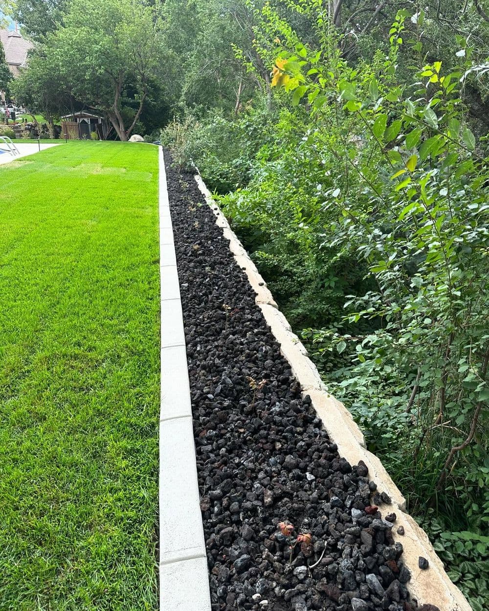 Post-Pool Landscape Install with Sod, Curbing, and Lava Rock in Lehi